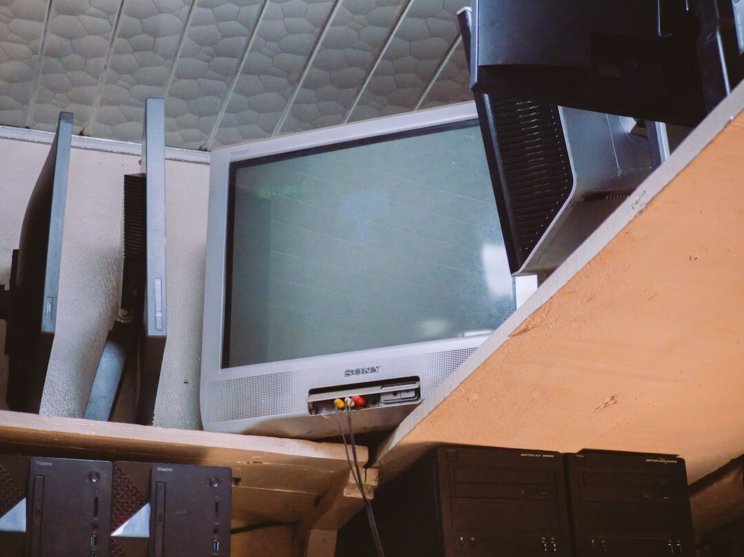 Modern newsroom desk with computer monitors