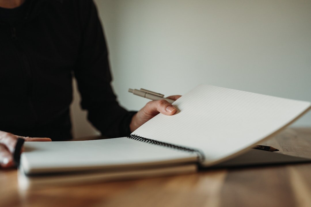 woman writing in notebook