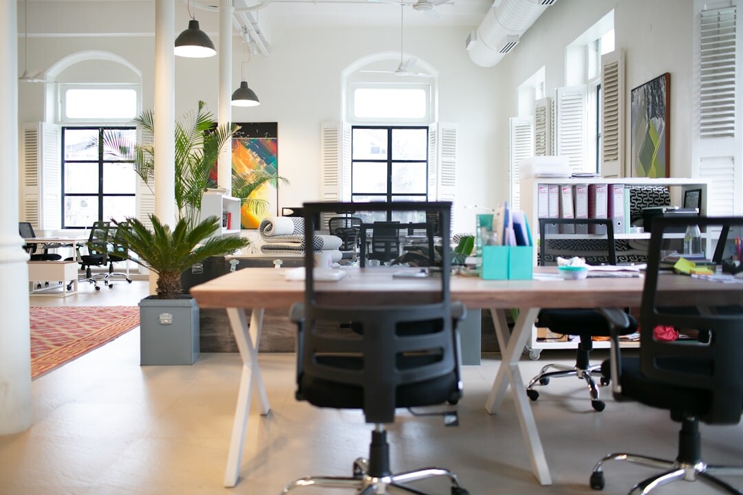 Modern office interior with desks and plants